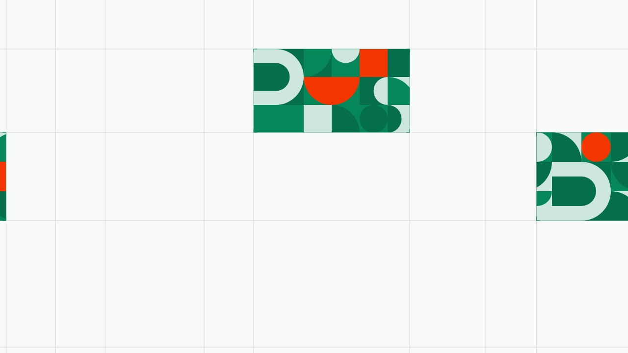 Modular green blocks, discs and arches arranged on a construction grid.